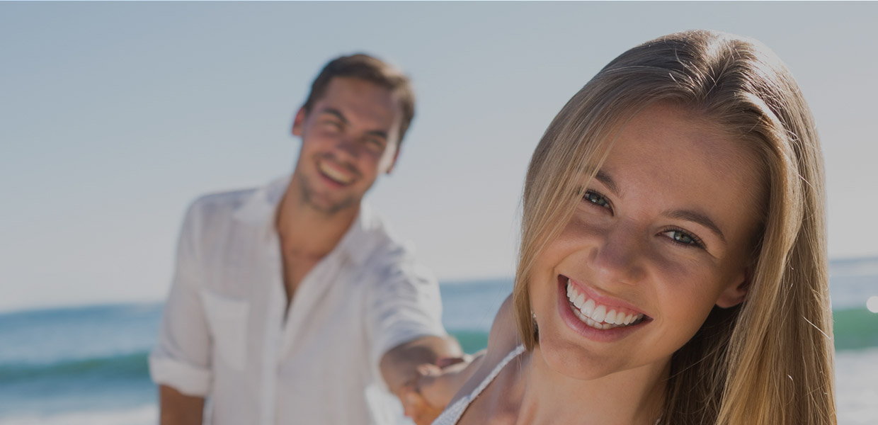Smiling couple visiting Britten Periodontics in Clearwater, Florida