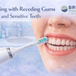 Illustration showing proper brushing technique with a Sonicare electric toothbrush for receding gums and sensitive teeth, highlighting gentle cleaning along the gumline, featuring the Britten Periodontics and Implant Dentistry logo.