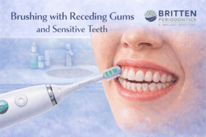 Illustration showing proper brushing technique with a Sonicare electric toothbrush for receding gums and sensitive teeth, highlighting gentle cleaning along the gumline, featuring the Britten Periodontics and Implant Dentistry logo.