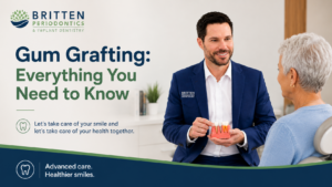 Periodontist explaining gum grafting treatment to a patient using a gum model